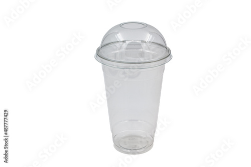 Transparent plastic glass for juice on a white background