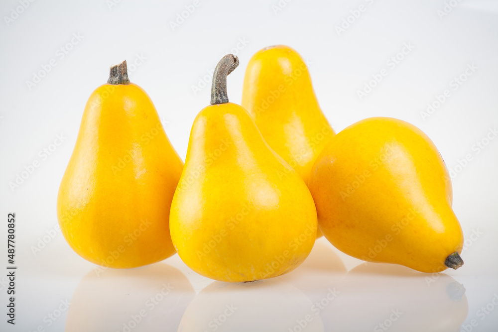 yellow pumpkins, gourds on a white background