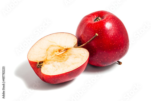 Juicy red apple fruit cut out on a white background. Organic ripe apples for a healthy vegetarian diet. View from above.