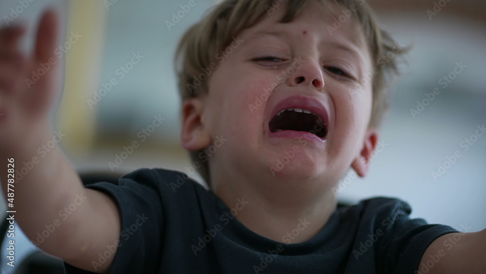 Upset child crying one small boy cries