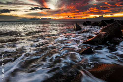 Asia culture - Beautiful landscape of sea level reflect fantasy dramatic sunset sky , the famous travel attractions in Fangshan pingtungcounty, Taiwan.  photo