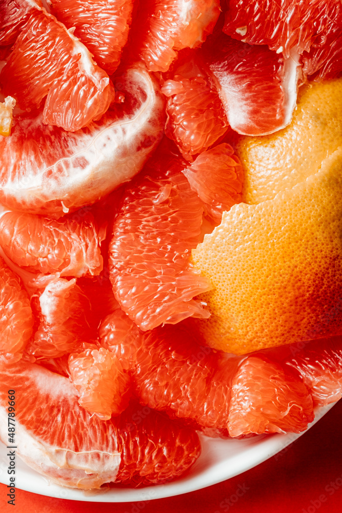 close up of a slice of grapefruit close up of a slice of grapefruit