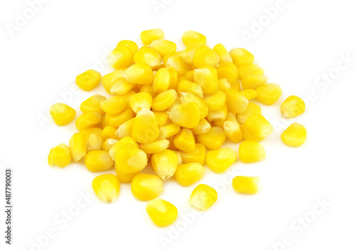 Heap of yellow sweet corn seeds isolated on white background 