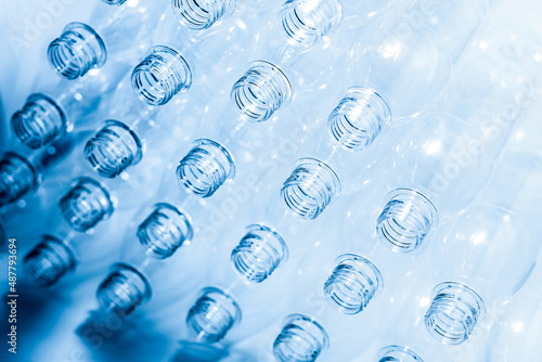 Bottling plant - Plastic bottles. Abstract background of plastic bottles. Selective focus