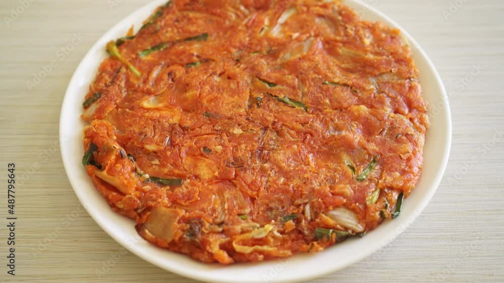 Korean Kimchi pancake or Kimchijeon - Fried Mixed Egg, Kimchi, and Flour - Korean food style Korean Kimchi pancake or Kimchijeon - Fried Mixed Egg, Kimchi, and Flour - Korean food style