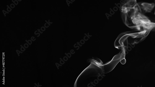 candle smoke trail isolated on a black background photo