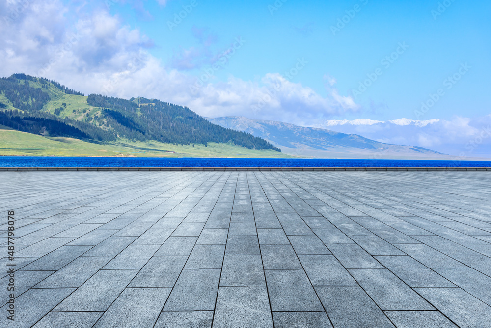 Empty square floor and mountain nature scenery under blue sky
