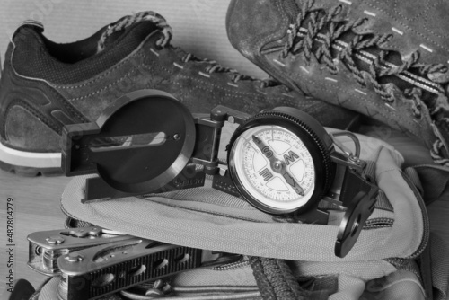 Compass and old hiking shoes