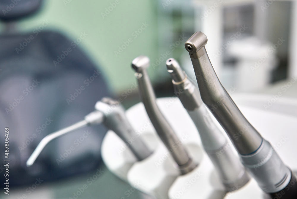 Dental drill close up and other dentist tools on a dentist chair. Dental drill close up and other dentist tools on a dentist chair.