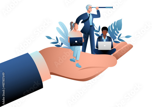 Giant hand holding a business workers