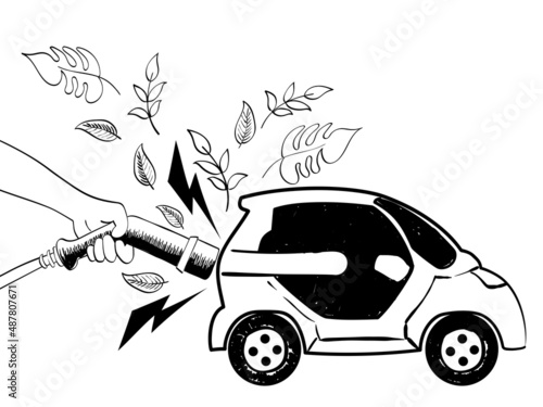 Hand holding a power cable supply to charging electric car