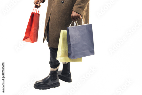 brown guy doing shopping focus on the bags white background - close-up shot. High quality photo