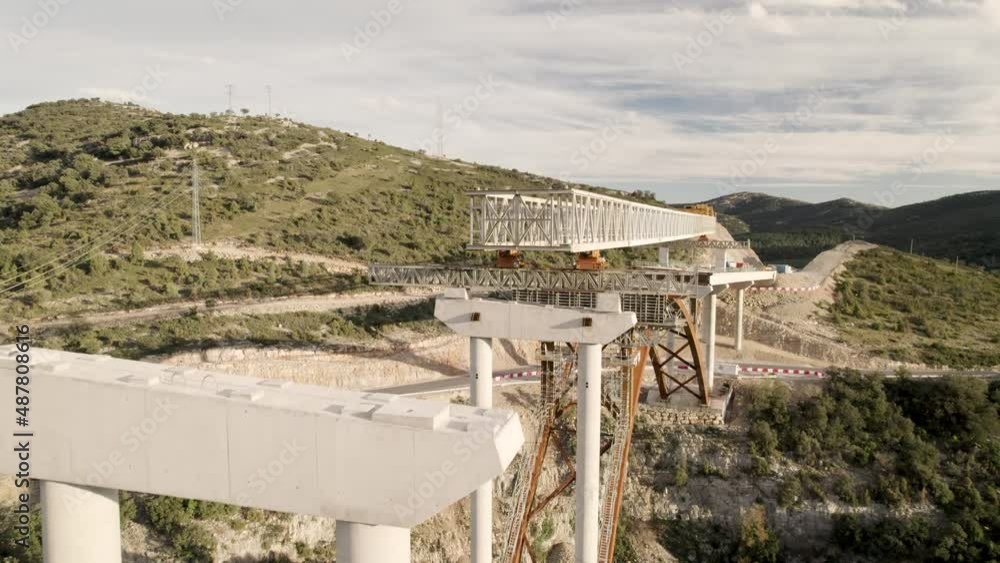 Drone fly-by motion video over a new bridge´s structure under construction in Barranco de la Bota in Morella Drone fly-by motion video over a new bridge´s structure under construction in Barranco de la Bota in Morella
