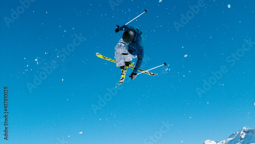 Billede på lærred Freestyle skier takes off the kicker and does a difficult high flying 360 grab