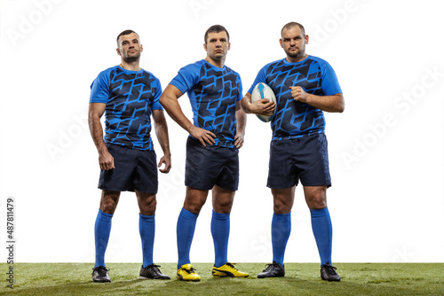 Fototapeta Naklejka Na Ścianę i Meble -  Group portrait of strong athletes, rugby players standing together like team isolated on white background. Sport, activity, health, hobby, occupations concept
