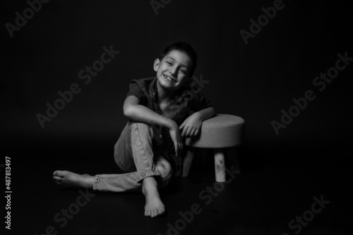 boy posing on a black background . close-up