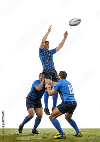 Three male rugby players playing rugby football on grass field isolated on white background. Sport, activity, health, hobby, occupations concept