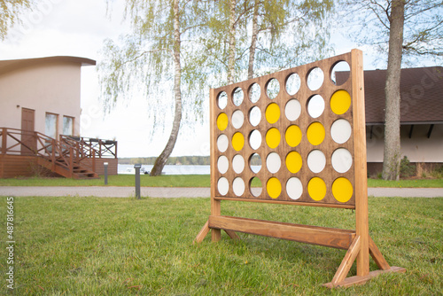 Giant connect four in a line garden wooden game