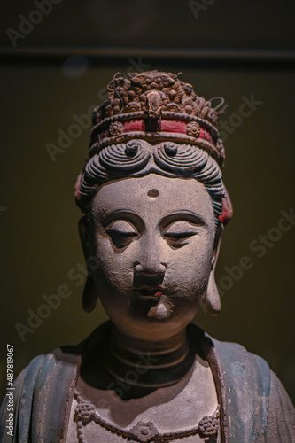 Close up of Guanyin Bodhisattva statue in ancient Buddhist temples in China