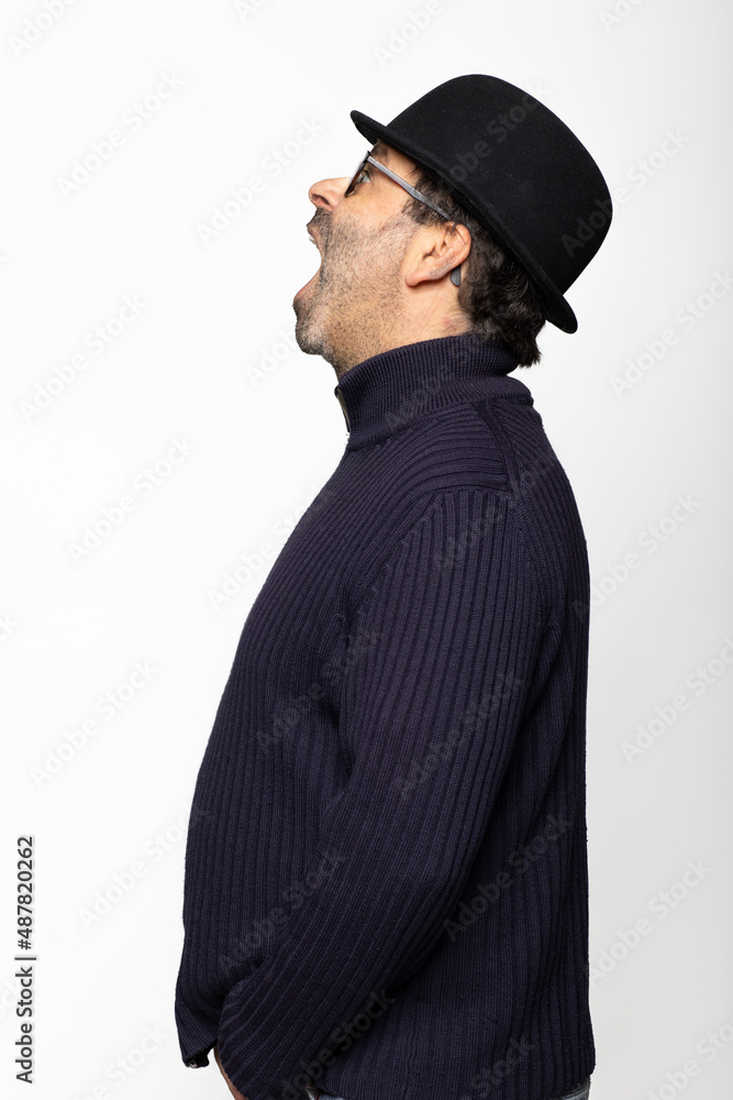 Portrait middle aged man with glasses, bowler hat and round glasses. In