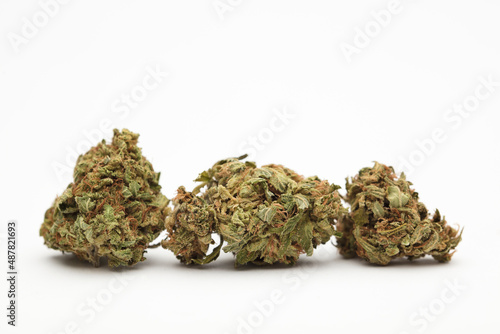 three marijuana buds. White background