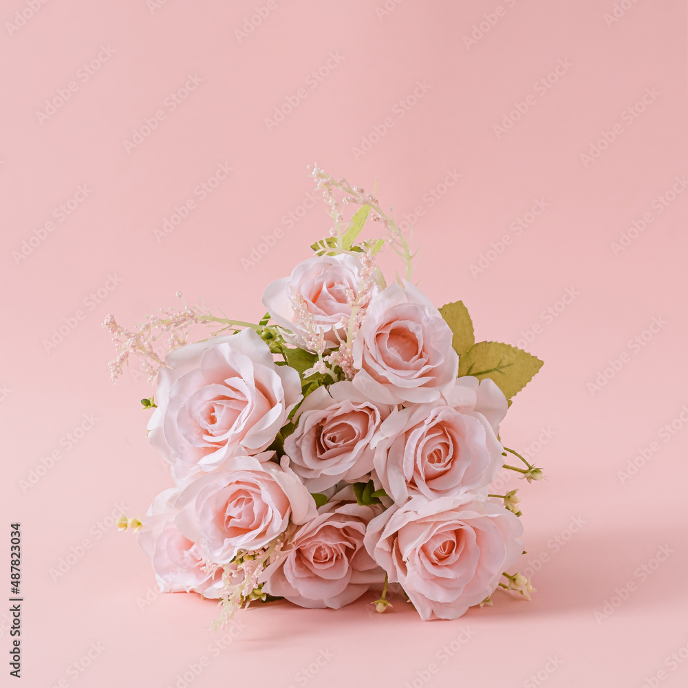 Bouquet of fresh pink roses on a square pink background Bouquet of fresh pink roses on a square pink background