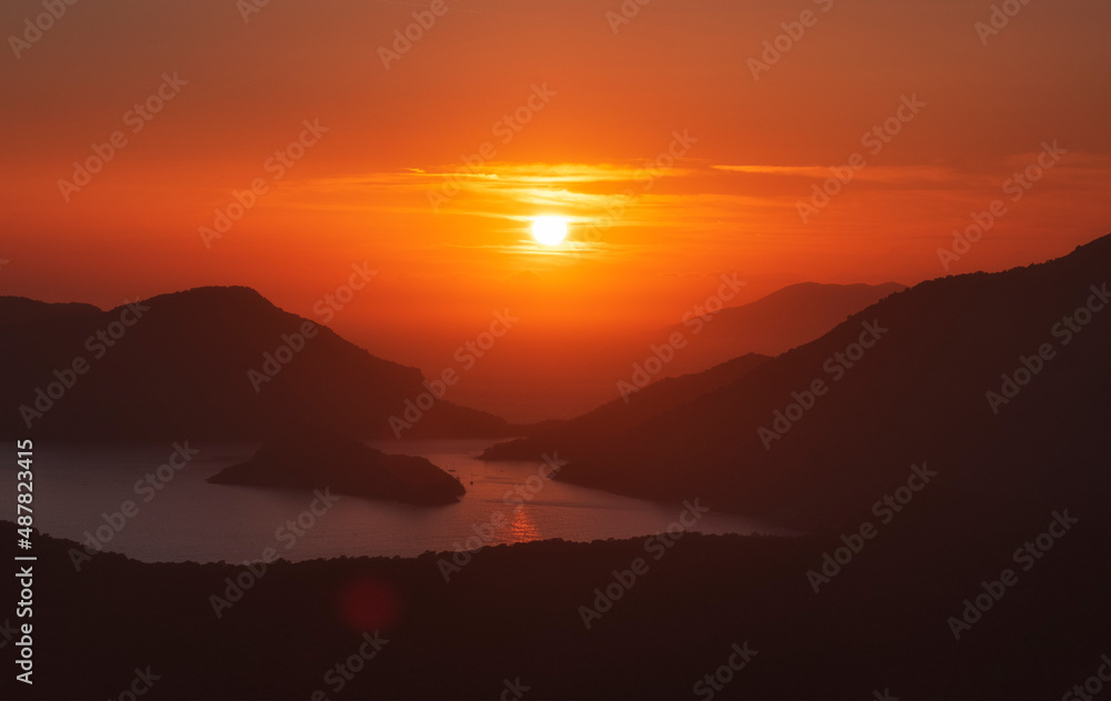 Dramatic sunset over the mountains and the sea