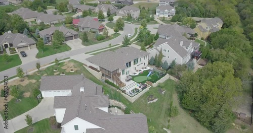 Drone Orbiting High over Homes in Wealthy Neighborhood