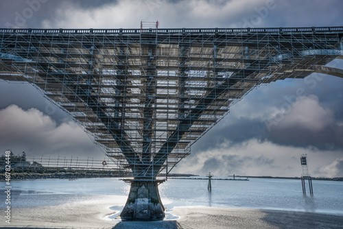 Scafolding on a pier of the Yaquina Bay Bridge, so repairs can be made, at Newport, Oregon, photo