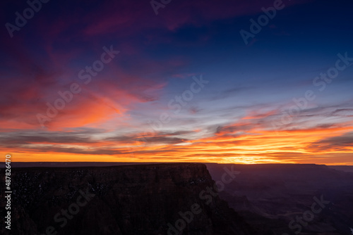 The Edge of the Grand Canyon Drops Off below sunset colors © kellyvandellen
