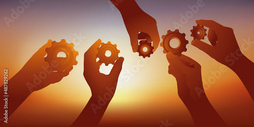 Concept du partenariat et de la collaboration avec des mains qui présentent des engrenages symbole du travail d’équipe.