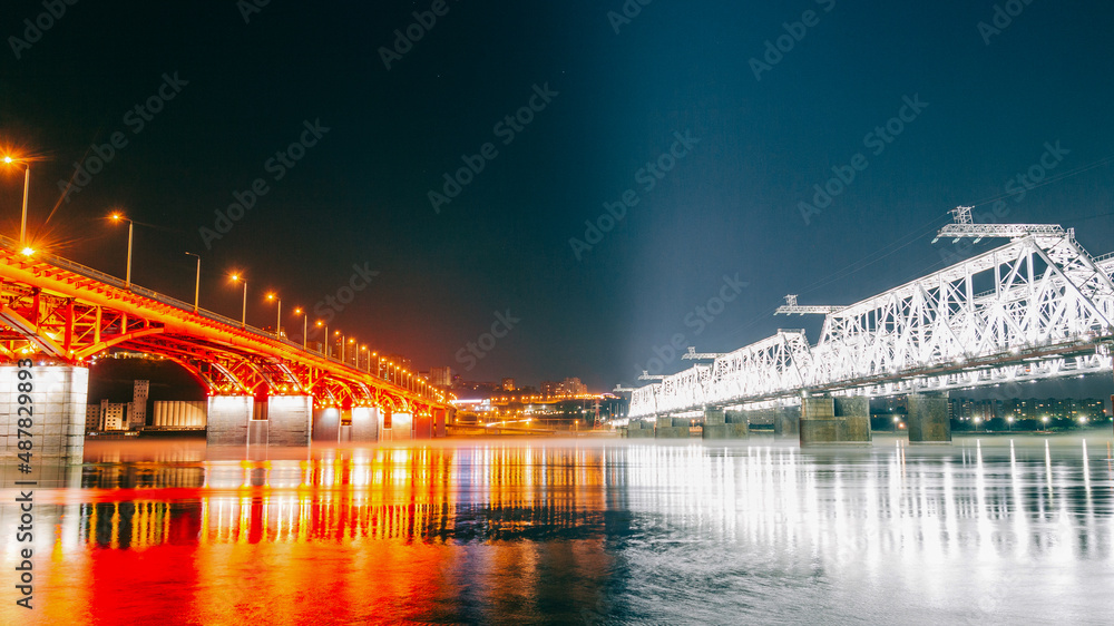 View of the river between two illuminated bridges. night city background