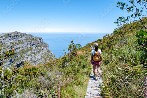 view from the Table Mountain in Cape Town South Africa, view over the ocean, and Lion's Head from Table Mountain Cape Town. woman visit mountain