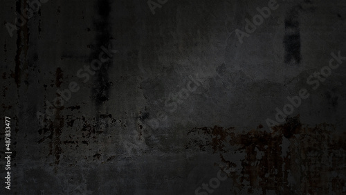 old black concrete wall of ancient architecture, cracked and dirty wall texture use as background with blank space for design. dirty dark black grunge cement with rust. vintage background.