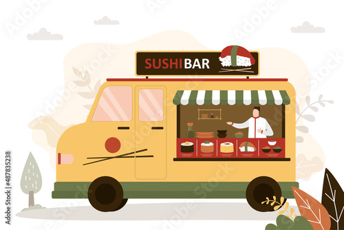 Chef in food truck preparing sushi for sale. Street cafe with traditional Asian cuisine. Small business