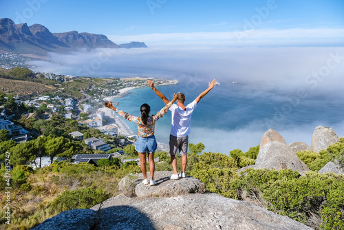 View from The Rock viewpoint in Cape Town over Campsbay, view over Camps Bay with fog over the ocean. fog coming in from ocean at Camps Bay Cape Town