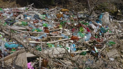 Ukraine, Kolochava. Environmental disaster in Transcarpathia. Residents of mountain villages throw plastic waste directly into the rivers,  Low ecology. Video flying drone. photo