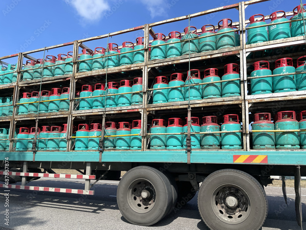 A photo of a truck loaded with gas steel containers in Paka, oil and gas processing station - obrazy, fototapety, plakaty 