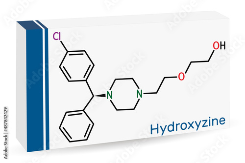Hydroxyzine molecule. It is antihistamine drug, used to treat anxiety and tension, as well as  pruritus and chronic urticaria. Skeletal chemical formula. Paper packaging for drugs