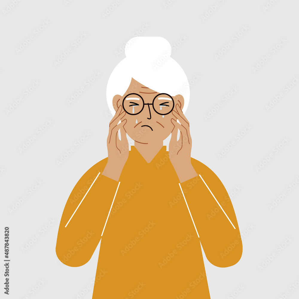 Upset grandmother cries and holds his head with his hands. The concept of resentment, pain and depression. Upset grandmother cries and holds his head with his hands. The concept of resentment, pain and depression.