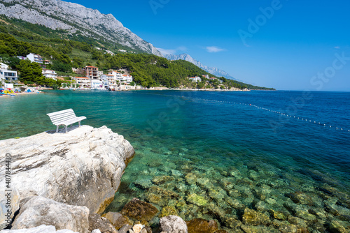 Obraz na płótnie amazing coast with white bench in Brela on Makarska riviera in Dalmatia in Croatia w salonie