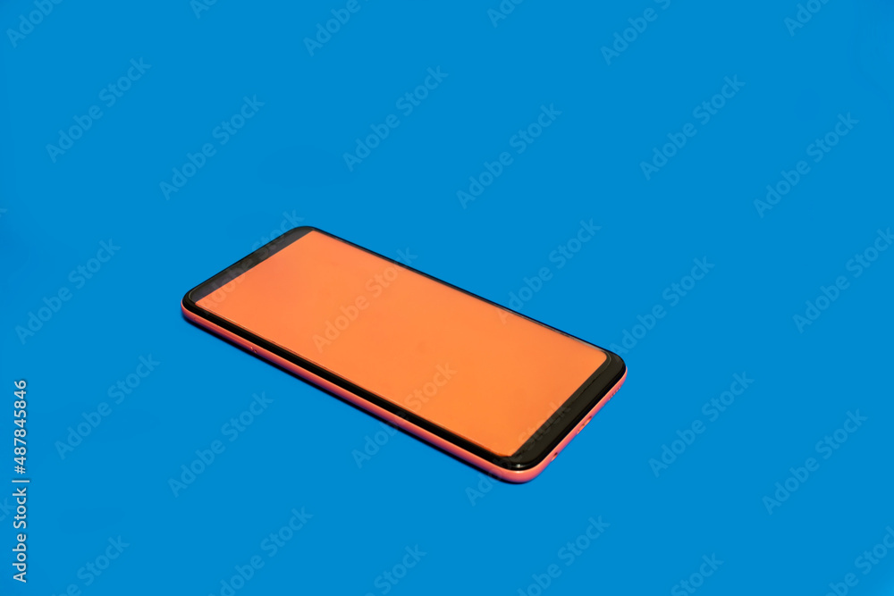 Mobile phone on blue background Mobile phone on blue background