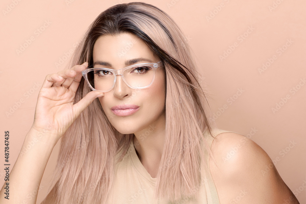 Gorgeous model girl with trendy clear glasses looking at camera posing in  studio. Fashion eyewear and clear vision concept Stock Photo | Adobe Stock