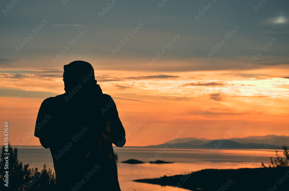 silhouette of a man on sunset