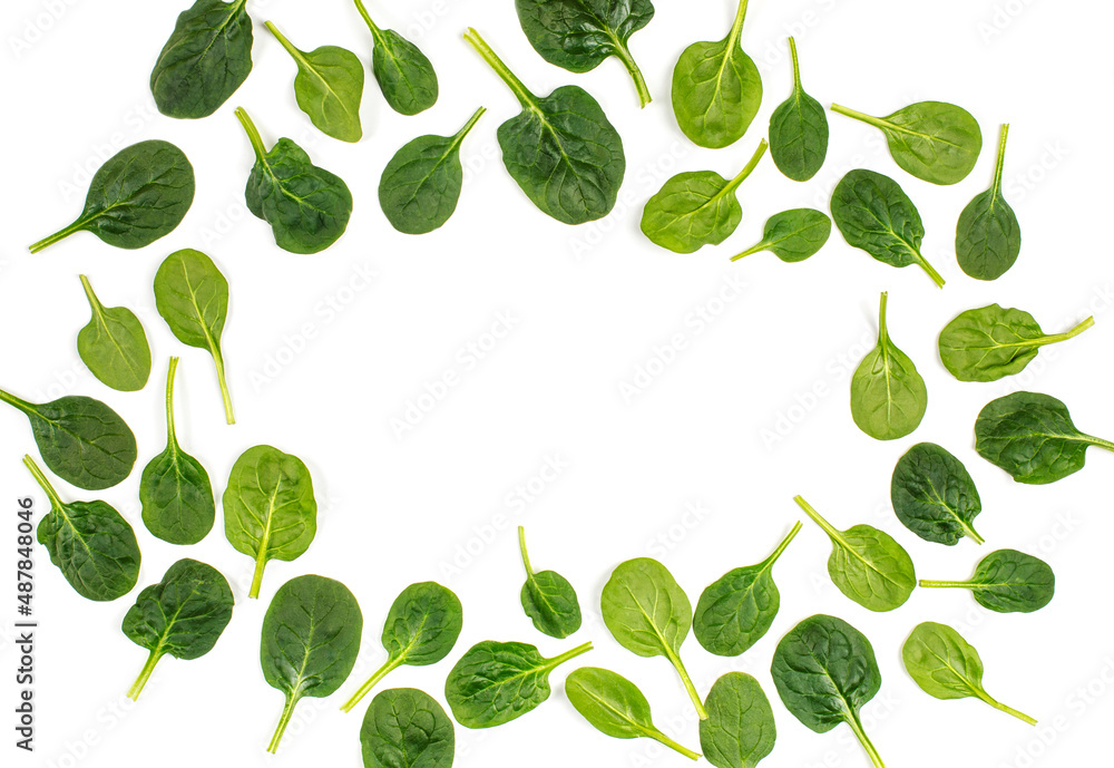 Fresh spinach leaves isolated on white background, top view, copy space.