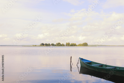 Landscape with a boat in a rural area on Lake Seliger with silence © Юлия Глазкова