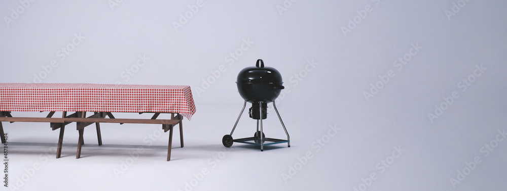 Picnic table and red checkered tablecloth with food and drink for outdoor party. Isolated white background. Wooden party table with foods and BBQ grills stove for summer picnics activities. Isolate. Picnic table and red checkered tablecloth with food and drink for outdoor party. Isolated white background. Wooden party table with foods and BBQ grills stove for summer picnics activities. Isolate.