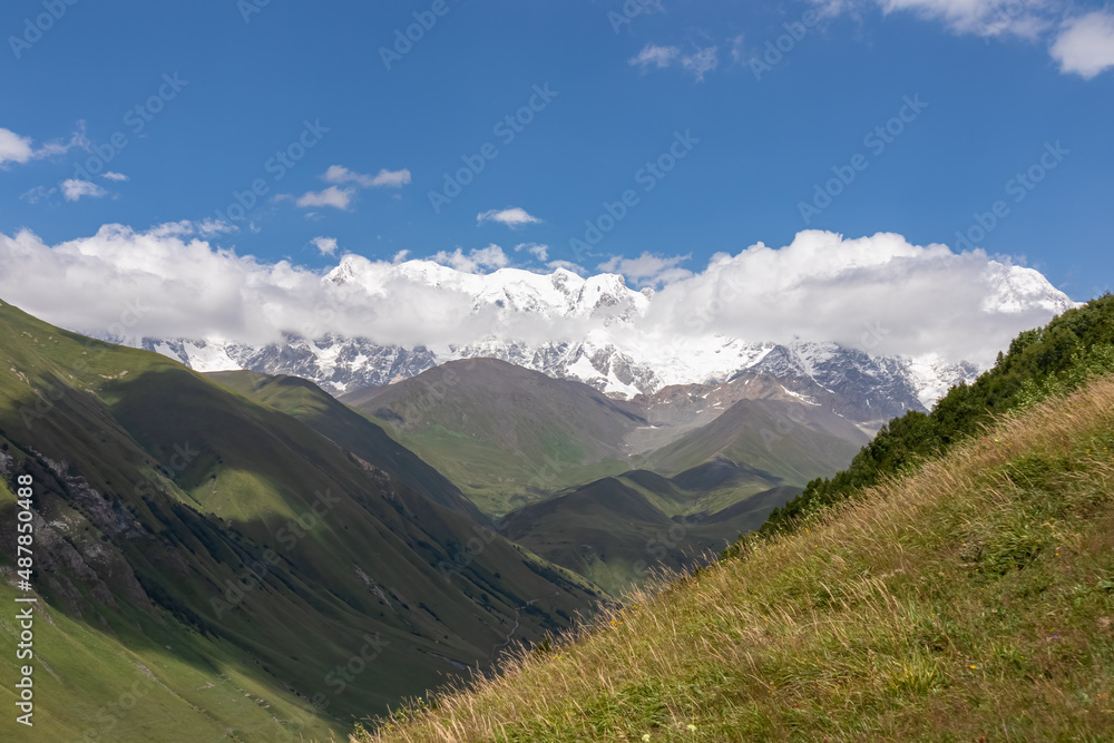 A hiking trail leading to Chubedishi viewpoint. There is an amazing view on the Shkhara Glacier,near the village Ushguli the Greater Caucasus Mountain Range in Georgia, Svaneti Region. Pasture, Meadow