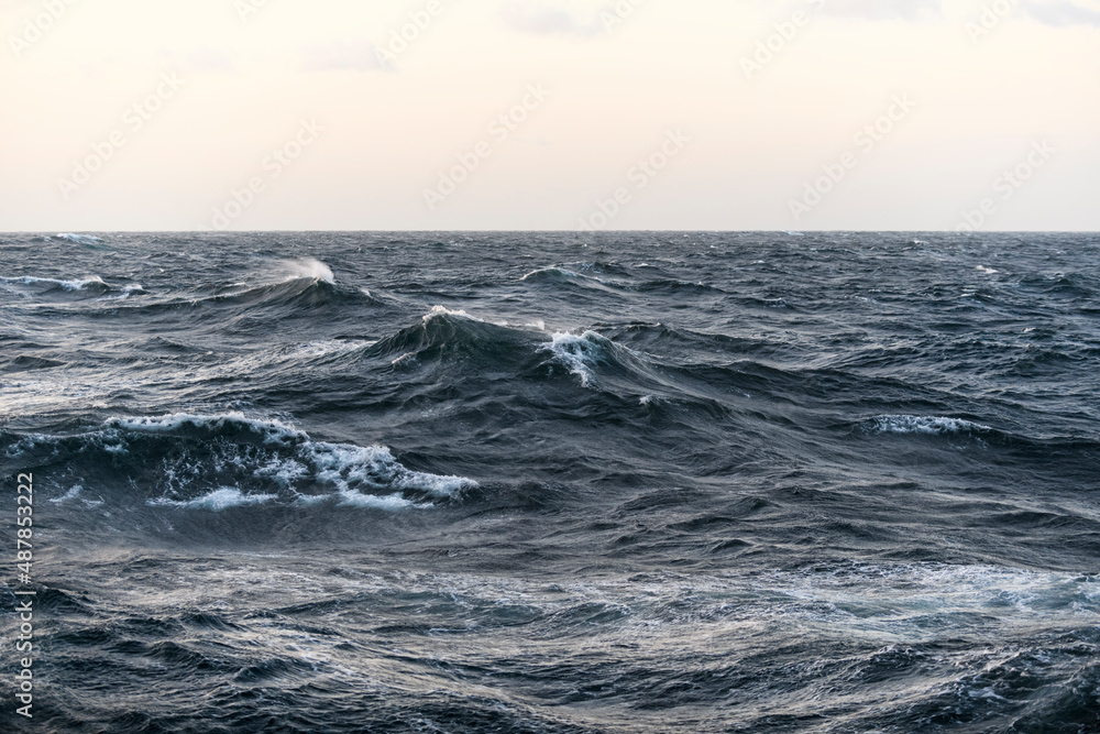Seascape, blue sea. Windy weather. View from vessel. Waves at sea. Storm.