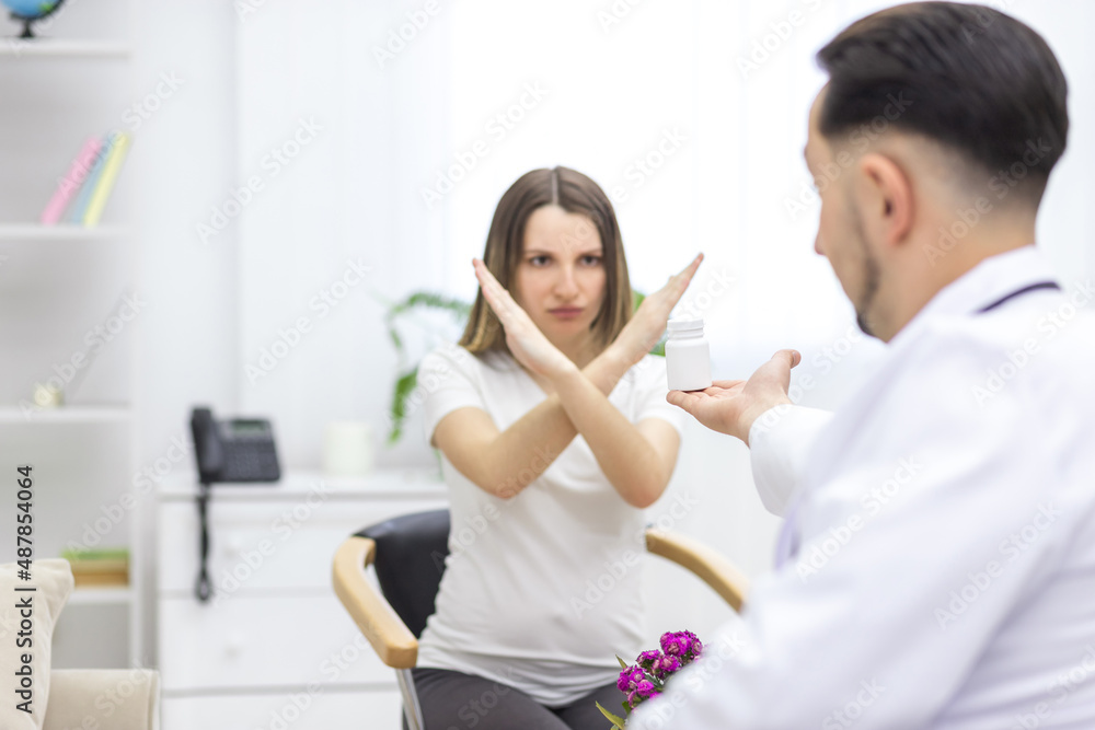 Photo of pregnant woman speaking with a doctor crossing hands. Photo of pregnant woman speaking with a doctor crossing hands.